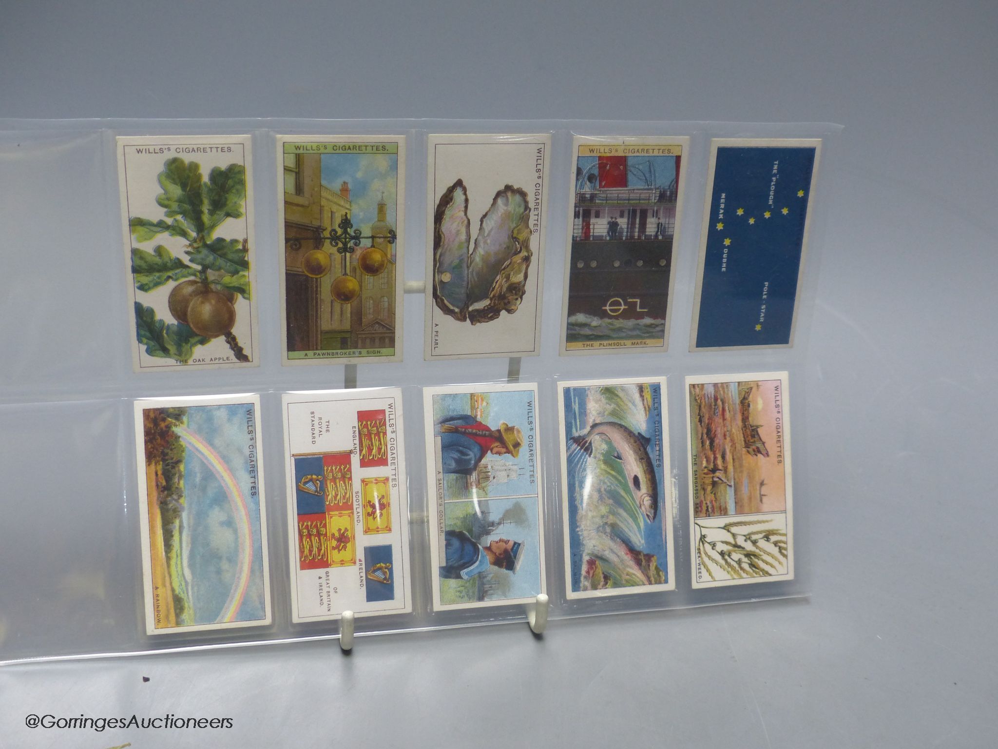 Smoking items including a Japanese camera lighter and cigarette cards